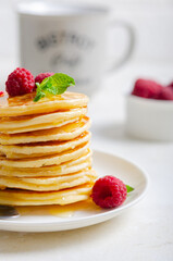 Delicious fluffy golden pancakes. Great idea for a sunny summer breakfast. A great treat for children.