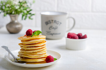 Delicious fluffy golden pancakes. Great idea for a sunny summer breakfast. A great treat for children.