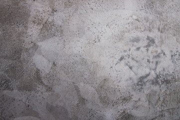 textured concrete plaster on a grey wall. High quality photo