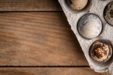 Quail eggs on the rustic background. Selective focus.