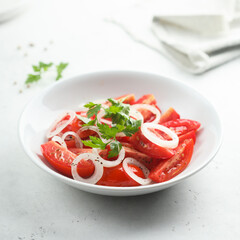 Healthy tomato salad with onion