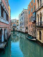 Fototapeta na wymiar Small canal street in Venice, Italy