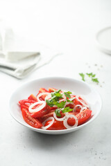 Healthy tomato salad with onion