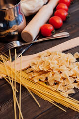 Fototapeta na wymiar cooking italian pasta by hand kitchen cherry tomatoes ingredients
