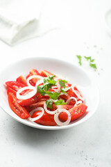 Healthy tomato salad with onion