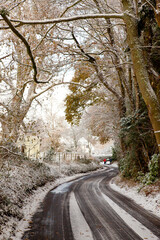 a country lane in the snow on a sunny day