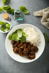 Homemade beef ragout with spinach and rice