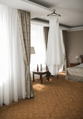 Wedding dresses in the room.