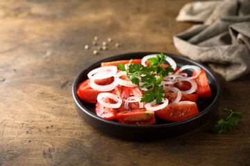 Healthy tomato salad with onion