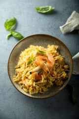 Spicy rice with shrimps and fresh basil