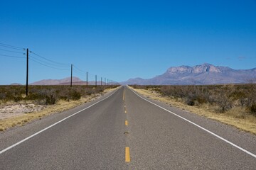 Endless desert road in West Texas USA 2