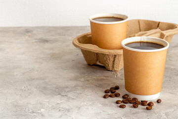 Obraz na płótnie Canvas Black coffee in paper cups with beans. Take away coffee background
