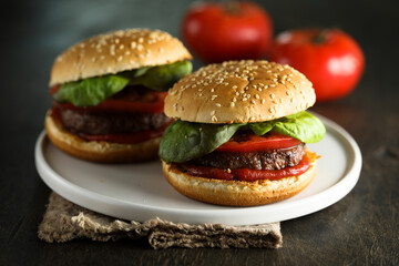 Homemade burgers with tomato and basil