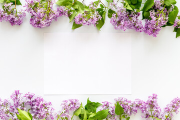 Frame of purple flowers - spring lilac branches with space for text