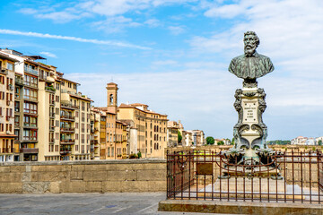 Cityscape of Florence from the on the Old Bridge ("Ponte Vecchio"), over the River Arno, beside Benvenuto Cellini's bust, Florence, Tuscany, Italy