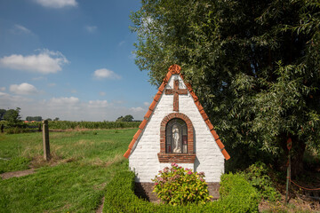 Fototapeta na wymiar small chapel, or Oratory, at the edge of a road in the Flanders in Belgium
