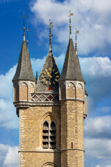 town hall in the Netherlands with a belfry, a Flemish clock tower in Sluis in the Netherlands