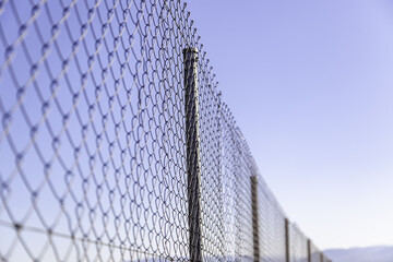 Metal fence with blue sky