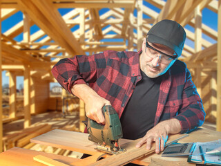 Work with an electric fret saw. Man is working on a tree. Construction of a frame building....