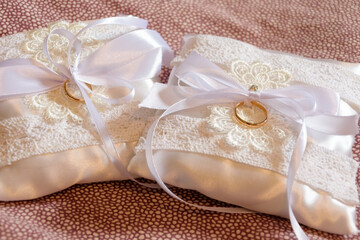 wedding rings presentation, wedding jewelry before the marriage celebration presented with strings and lace 
