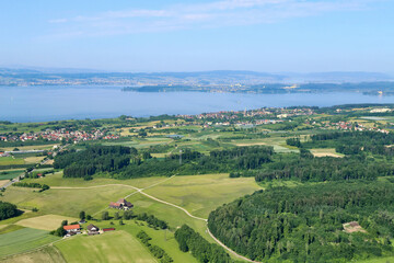 Fototapeta na wymiar Aerial landscape with Boden lake. Towns Stetten, Meersburg and Konstanz are visible. Two ferries are sailing across the lake