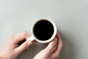 Close-up of the person having a cup of coffee. コーヒーを飲んでいる人のクローズアップ	
