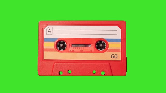 4K: Audio Cassette Tape playing in Recorder - Vintage retro. In front of Green Screen Chroma key Background. Stock Video Clip Footage