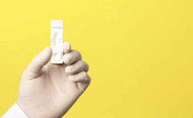 COVID-19 virus disease test in the hands of doctor, coronavirus crisis test, global pandemic outbreak, deadly SARS-CoV-2 epidemic, test kit illustration, yellow background.