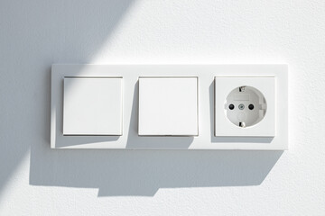 Modern White switch board with two switch and one european plug