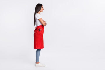 Full size profile side photo of happy woman hairdresser look copyspace with crossed arms isolated on grey color background