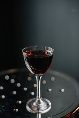 Manhattan cocktail decorated with lemon zest.