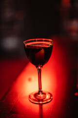 Manhattan cocktail decorated with lemon zest.