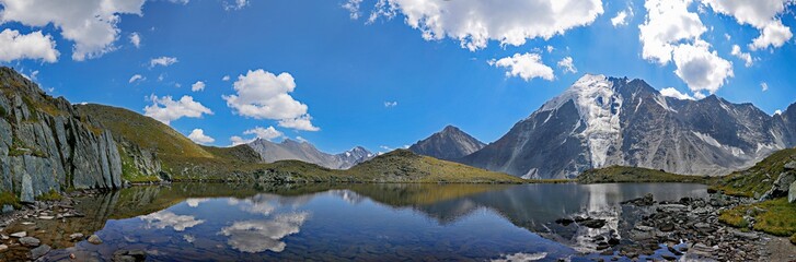 Naklejka na ściany i meble panorama of a mountain lake in the valley of seven lakes near Belukha Altai mountain