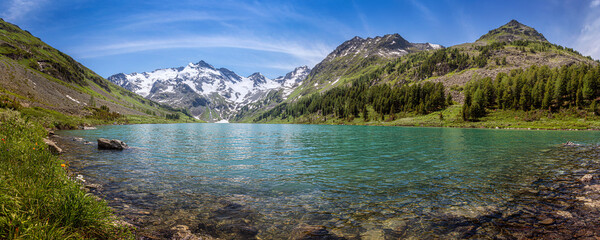 panorama of the lake with emerald water on the background of the mountains