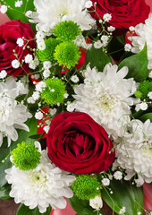 Top view. Bouquet of bright spring flowers of roses and chrysanthemums