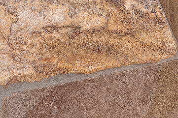 Beige granite stone wall background