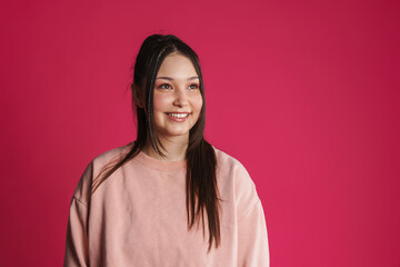 Asian brunette happy woman smiling and looking aside