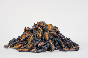 Natural dried prunes. Dried plums on white background. Studio photo. Free space for text. Product for sale.  Health, organic concept.