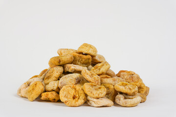 Natural dried figs. Sun dried figs on white background. Studio photo. Sun dried fruits. Copy space.  Health, organic concept.