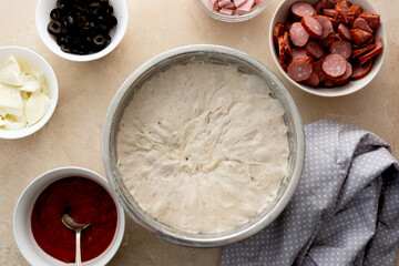 Pizza preparation coooking process with sourdough homemade natural east dough, top view