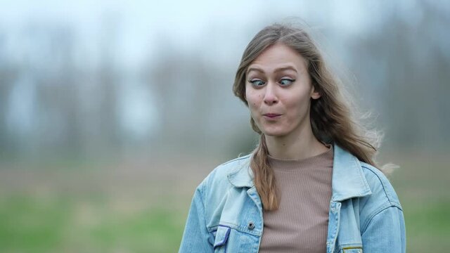 [4k] young blonde woman making funny face