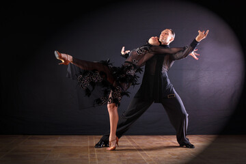 Dancers in ballroom isolated on black background