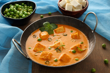 Matar Paneer curry recipe made using cottage cheese, green peas, Kerala, Delhi, Rajasthan India. Top view North Indian veg curry side dish of Roti, Chapati, naan, Pulao