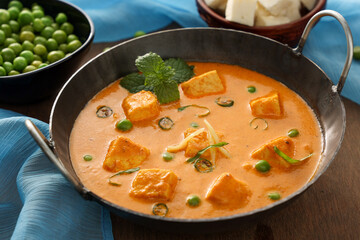 Matar Paneer curry recipe made using cottage cheese, green peas, Kerala, Delhi, Rajasthan India. Top view North Indian veg curry side dish of Roti, Chapati, naan, Pulao