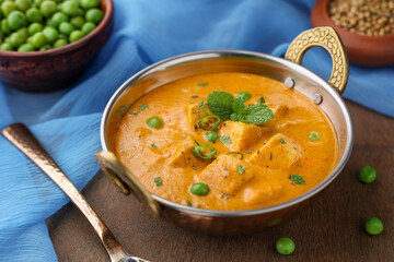 Matar Paneer curry recipe made using cottage cheese, green peas, Kerala, Delhi, Rajasthan India. Top view North Indian veg curry side dish of Roti, Chapati, naan, Pulao