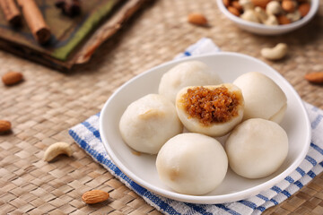 Kozhukatta Pidi and Indian milk tea Kerala tea time snack steamed food sweet modak rice dumpling Ganesh Festival Inda rice flour, sweet food stuffed grated coconut jaggery, christian food Palm sunday