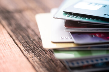 Colorful stack of credit cards. Macro photo of pay cards. Online payment.