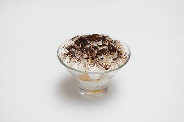 Tasty milk shake with chocolate topping on white background