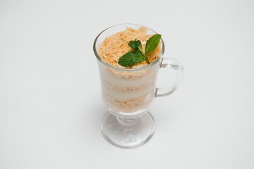 Tasty milk shake with chocolate topping on white background