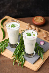 Spiced buttermilk , chaas , chaach , moru , sambharam , curd, lassi , yogurt, cool refreshing drink for hot summer in glass , Kerala, India. Flavored Indian buttermilk.